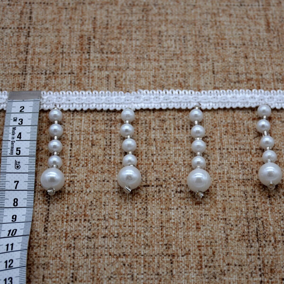 Dekoras užuolaidoms baltos spalvos perlamutriniai kutai 7 cm